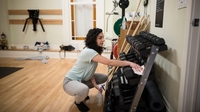 Women cleaning dumbbells are Yoga Space  thumbnail