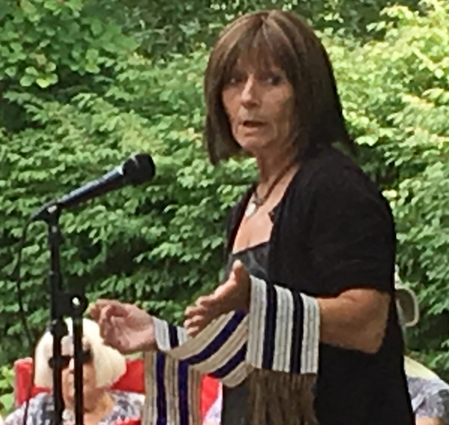 Photo of Jan Sherman giving a talk at a Tea n' Tales event. 