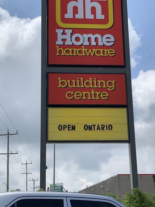 Home Hardware Building Centre's outdoor signage, approximately 20 feet tall, calling "Open Ontario" during Ontario's third lockdown during the COVID-19 pandemic.