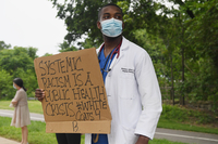 Doctor Holding a Sign  thumbnail